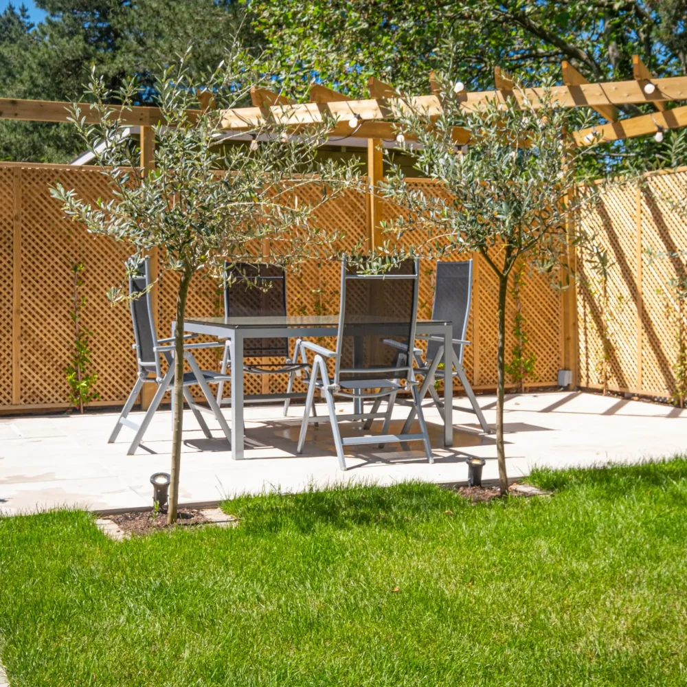 Bespoke pergola with patio, garden fencing and landscaped lawn by Bamboo Landscapes